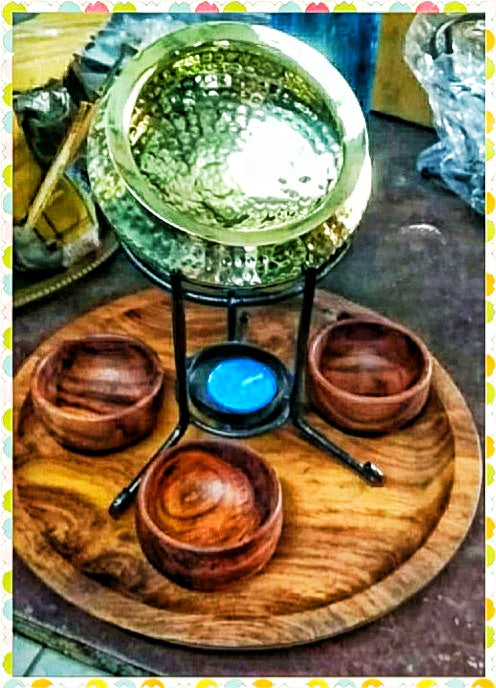 Dal handi platter with a brass hammered handi and a tealight
